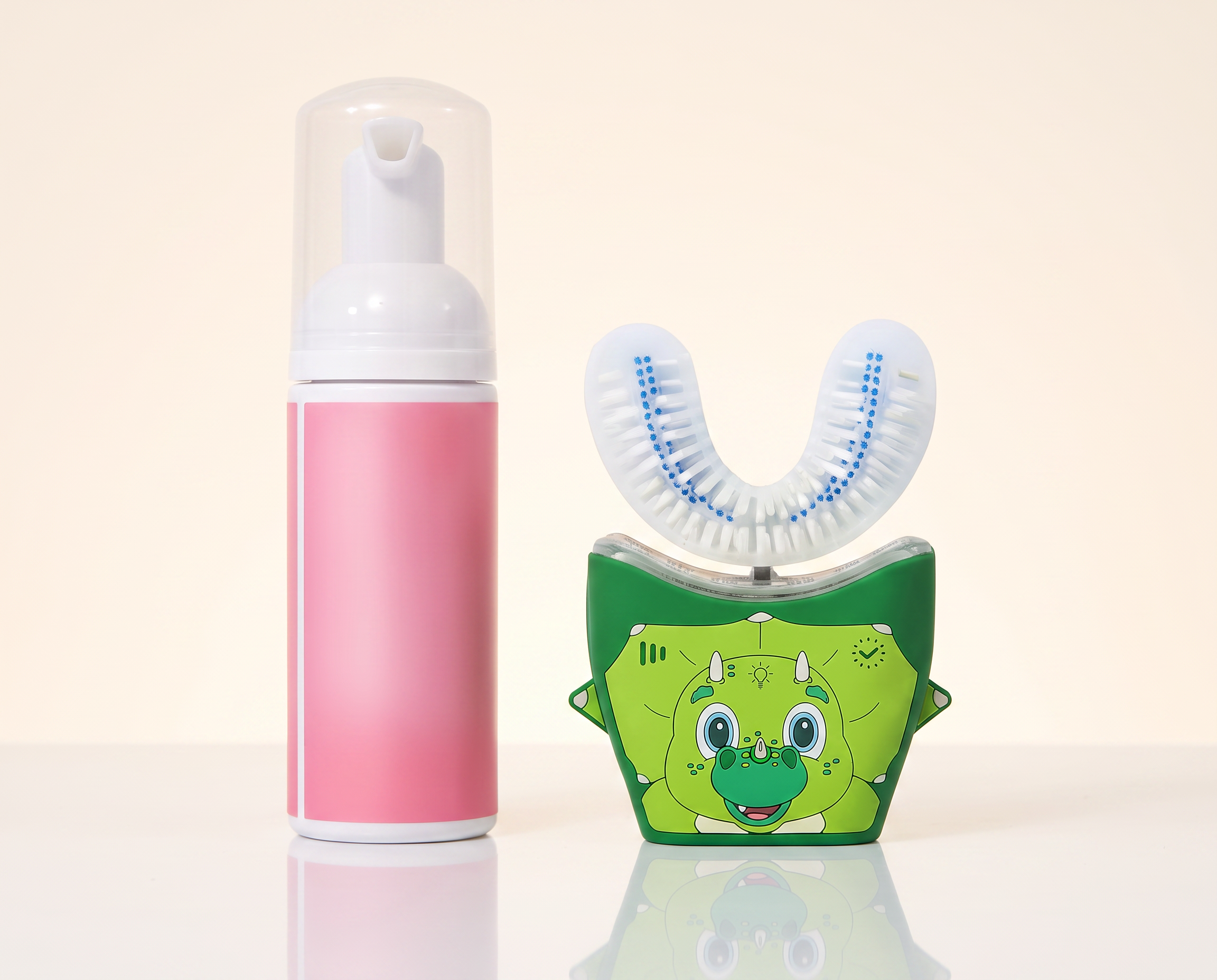 Kids 360° Sonic Brush with the green dino base beside the foaming toothpaste